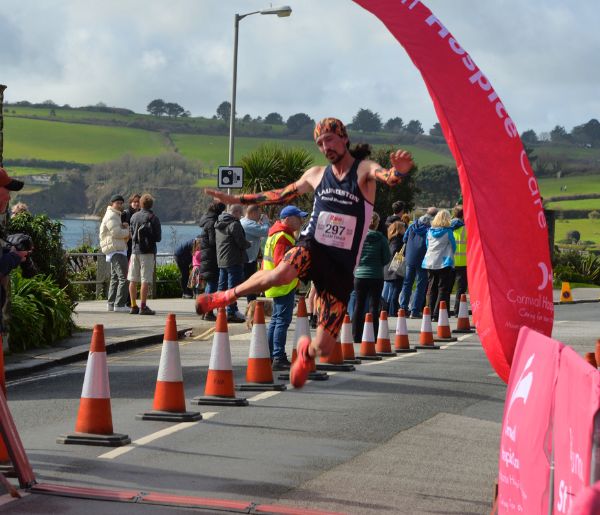 Run Falmouth Half Marathon Jumping across finish line